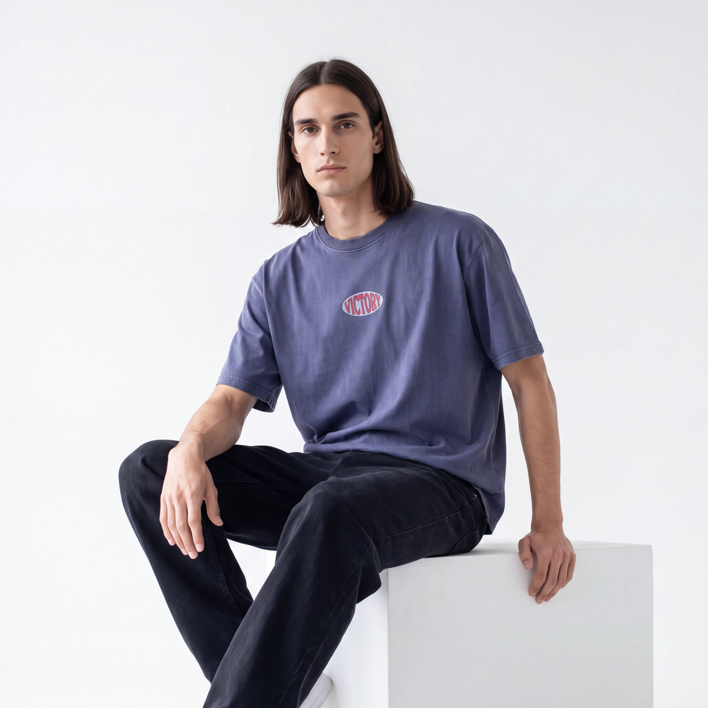 AI-generated on-model photograph of a graphic tee, produced by Nokkh for a brand catalog